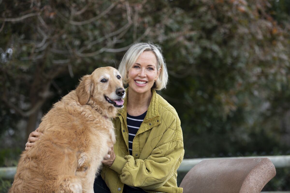 Barbara-Lee Edwards plays with her dog, Charlotte, at Maggie Houlihan Memorial Dog Park.
