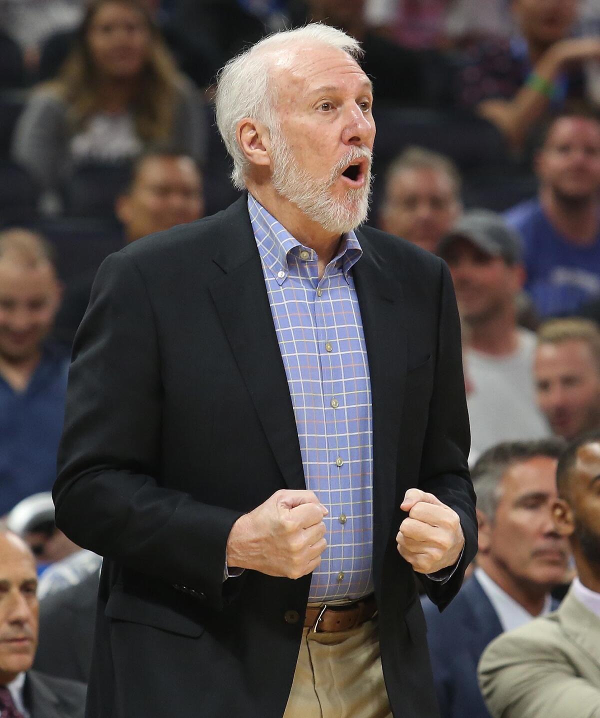 Spurs coach Gregg Popovich calls out to his players during a game against the Magic on Oct. 27.
