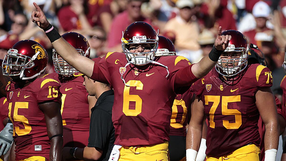 USC quarterback Cody Kessler celebrates after throwing a touchdown pass against Colorado.