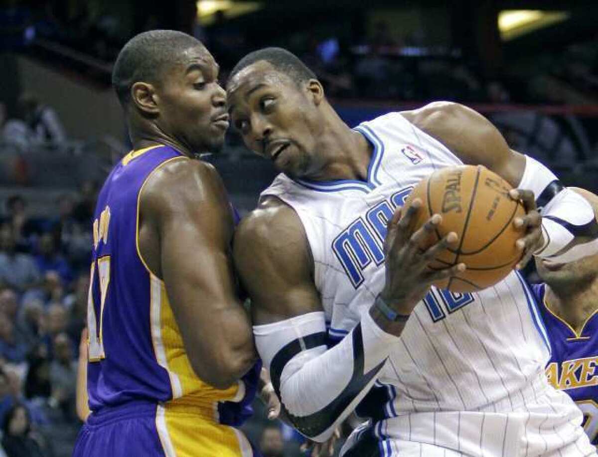 Orlando's Dwight Howard, right, pushes past Andrew Bynum during the second half of a Jan. 20 game.