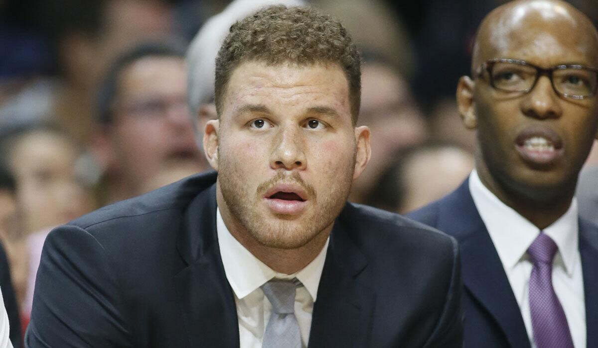 Blake Griffin watches as the Clippers play Miami on Jan. 13.