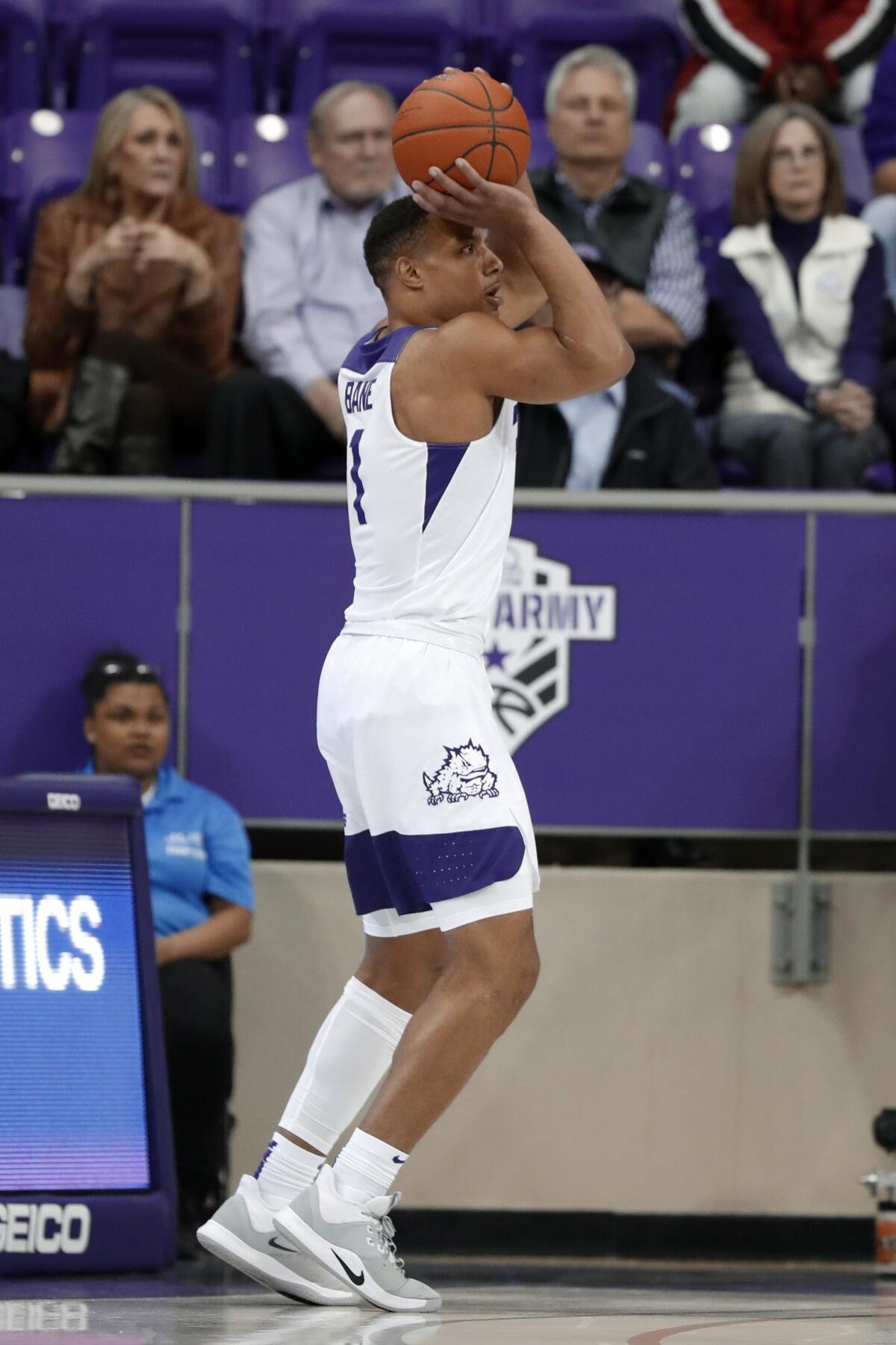 TCU guard Desmond Bane attempts a 3-point basket during the first half of the team's NCAA college basketball game against Louisiana-Lafayette in Fort Worth, Texas, Tuesday, Nov. 12, 2019. (AP Photo/Tony Gutierrez)