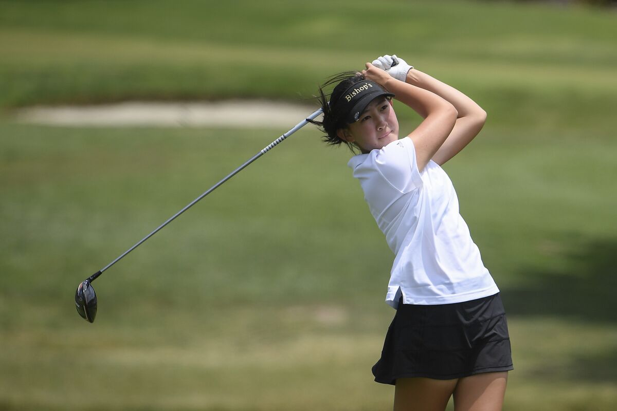 Lucy Yuan of Bishop's High School hits her tee shot on the 18th hole during the CIF girls golf finals in June.