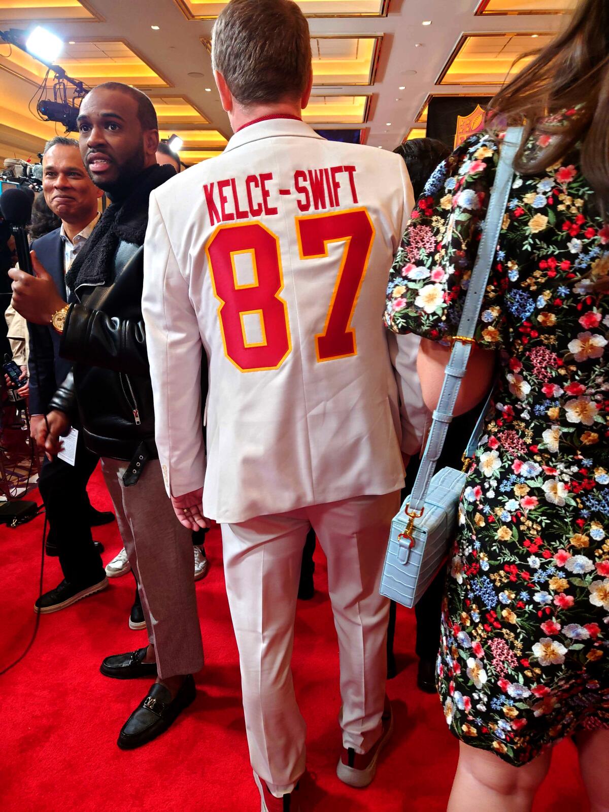 Curtis Unfried, a football fan from Winnipeg, Canada, made a custom Swift-Kelce suit to wear for Super Bowl week.