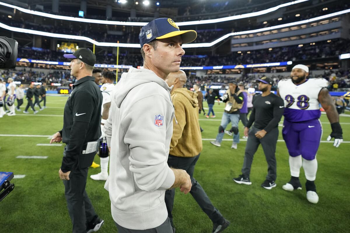 Chargers coach Brandon Staley walks off the field after a loss to the Baltimore Ravens.