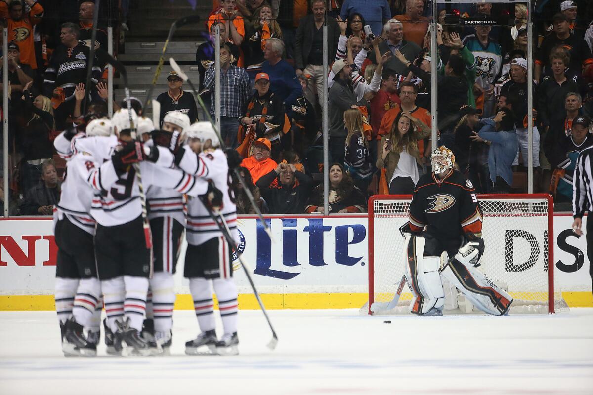 Jonathan Toews and his Blackhawks teammates celebrate after scoring a goal late in the third period of Game 5 of the Western Conference finals.