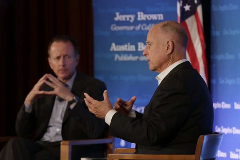 Times Publisher and CEO Austin Beutner, left, discusses water issues with Gov. Jerry Brown Tuesday night at USC.