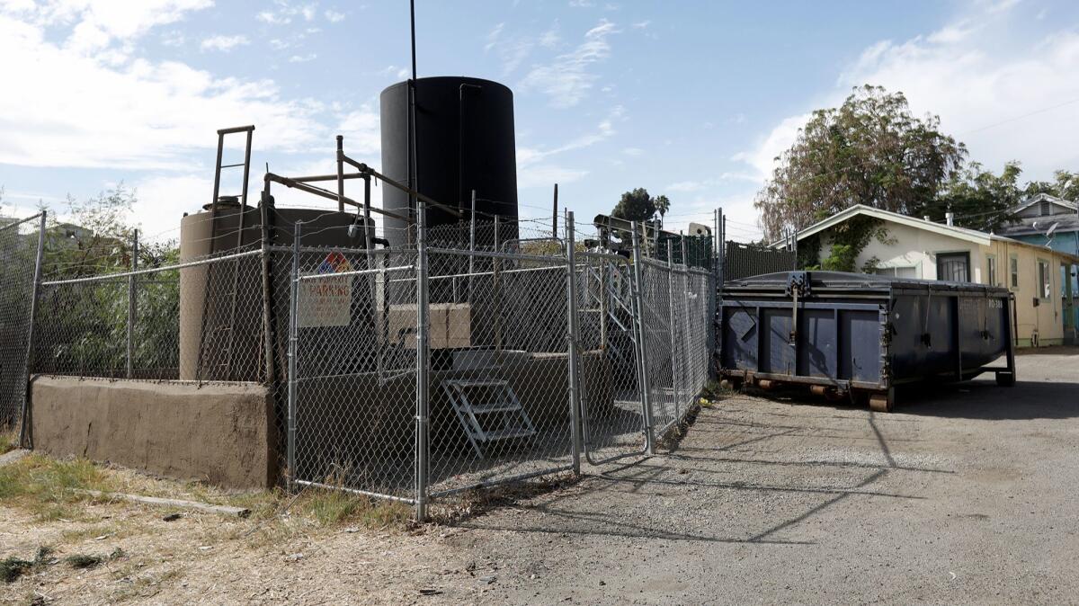 Los Angeles officials are preparing multiple citations against the owner of this downtown oil well after discovering more than 200 plastic bags filled with oil-soaked dirt they believe were about to be removed to avoid detection of a spill.