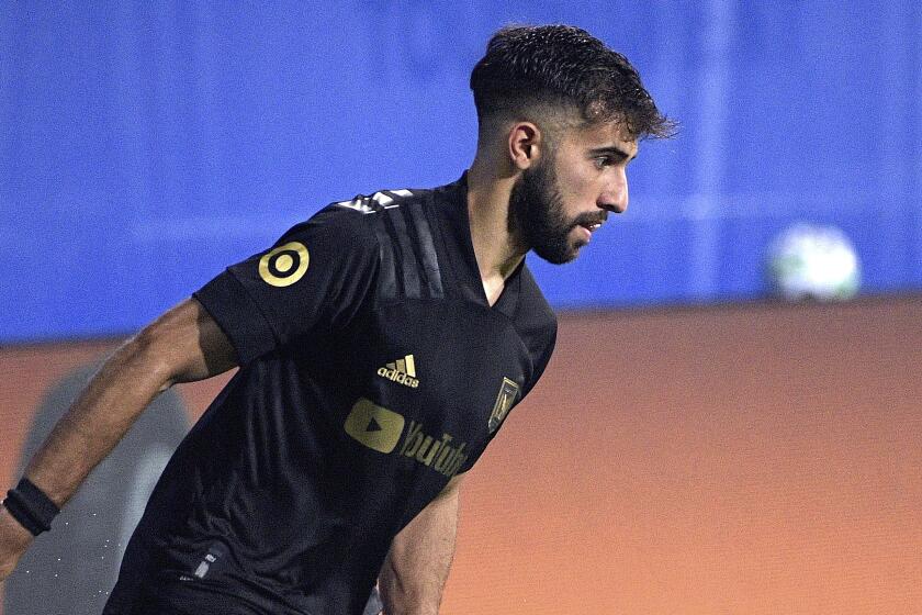Los Angeles FC forward Diego Rossi (9) sets up a play during the second half of an MLS soccer match.