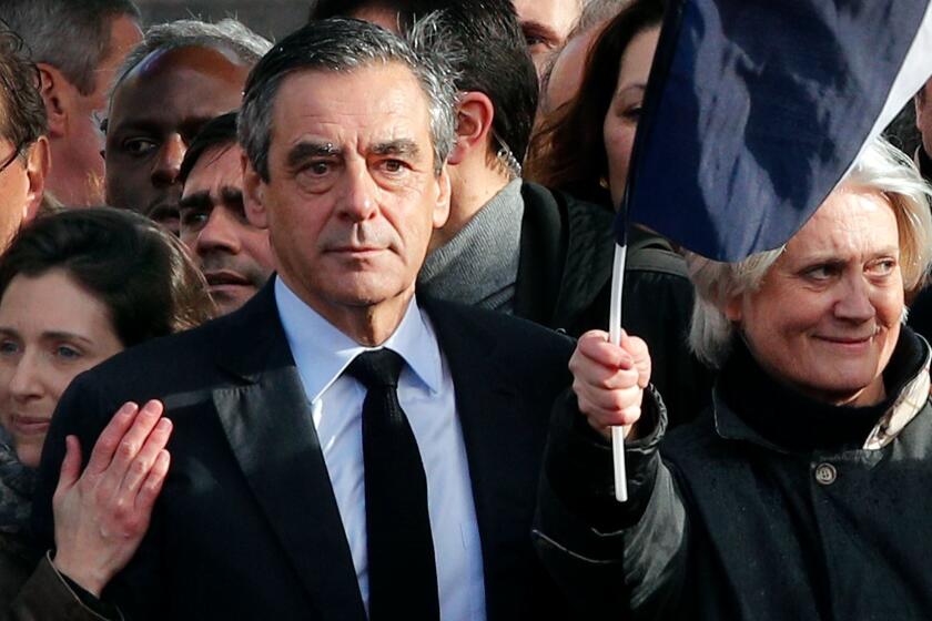 French conservative presidential candidate Francois Fillon, his wife, Penelope, right, and his daughter, Marie, appear at a rally in Paris on March 5, 2017.
