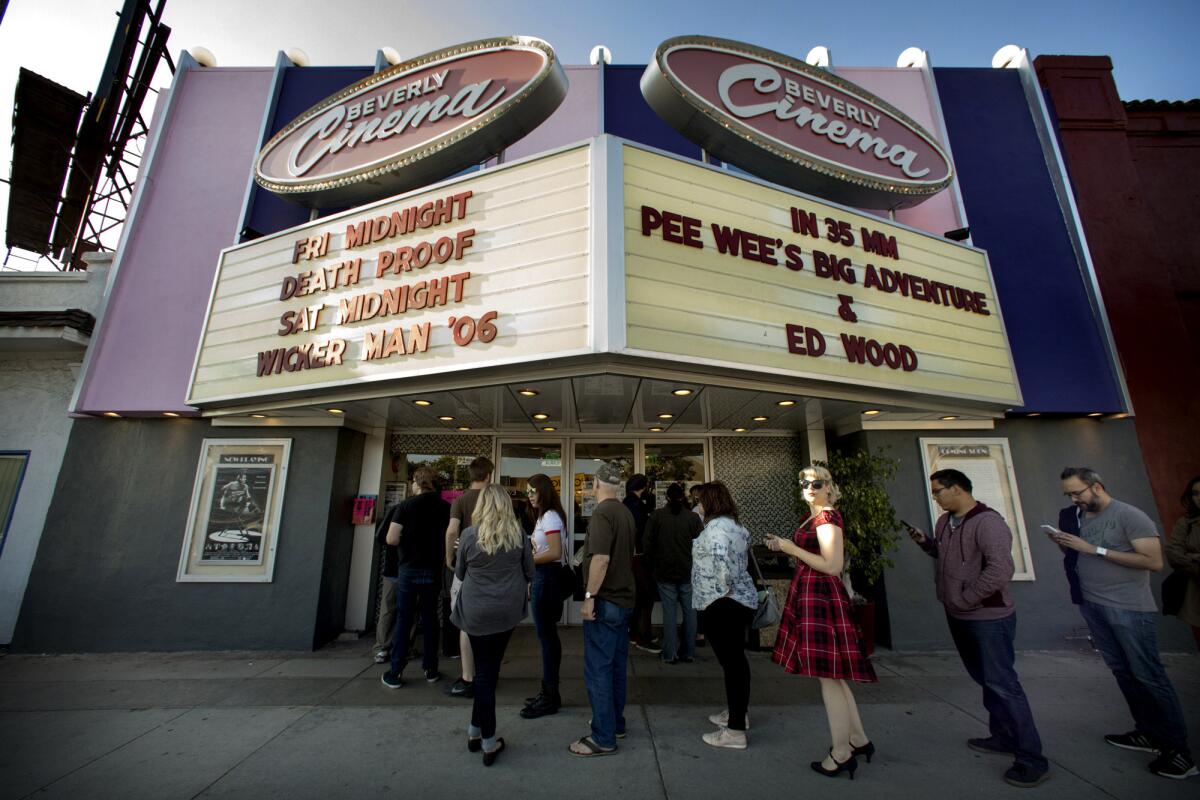 Moviegoers at the New Beverly Cinema wait in line for the Tim Burton double feature of "Pee-wee's Big Adventure" and "Ed Wood." The New Beverly Cinema is known for its daily screenings of 35mm films as opposed to digital formats.