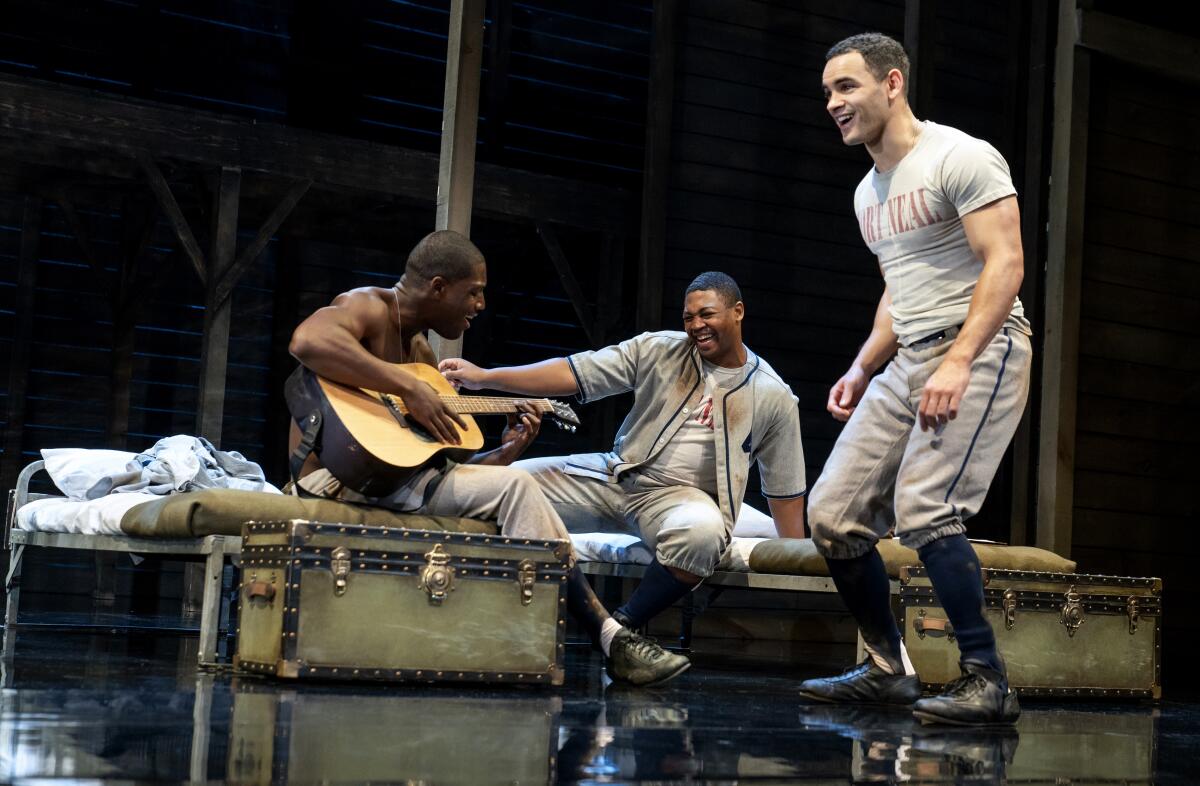Sheldon D. Brown, Branden Davon Lindsay and Will Adams sit on army bunks in "A Soldier's Play" 