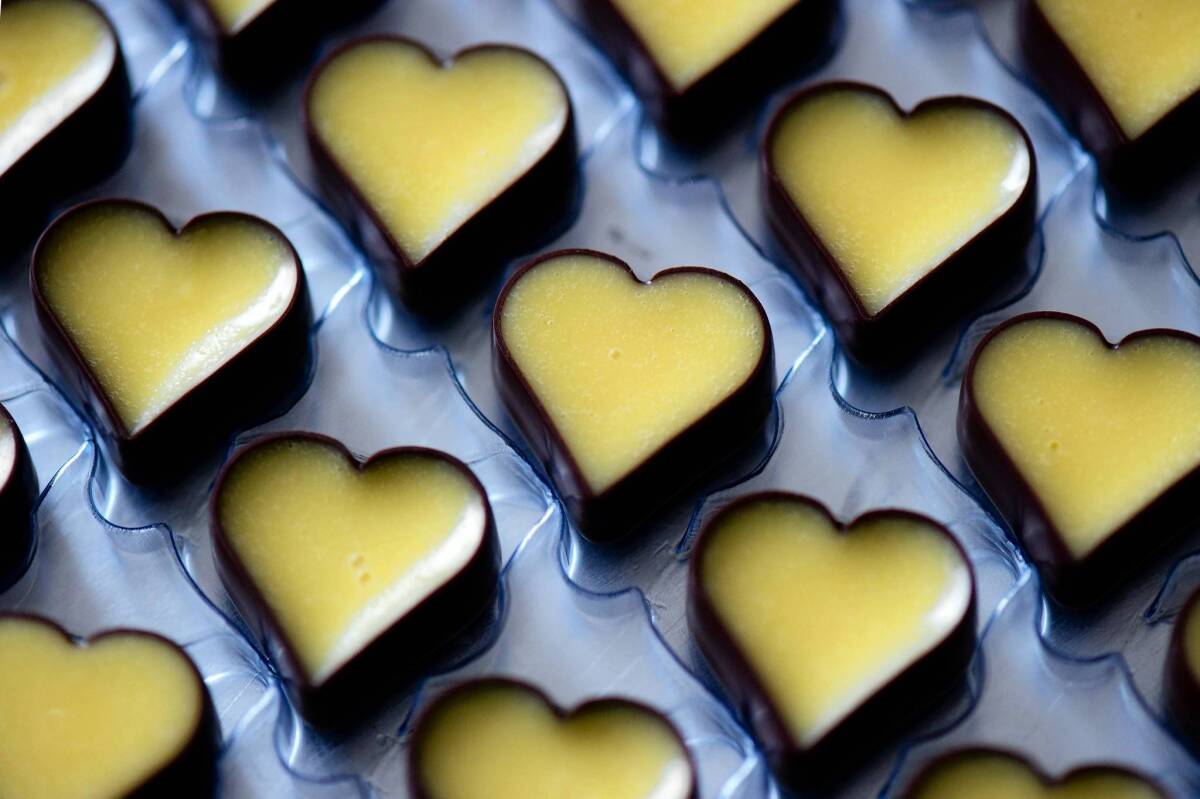 Heart-shaped candies made from advocaat sit in their mold at the chocolate factory in Heidenau, Germany.