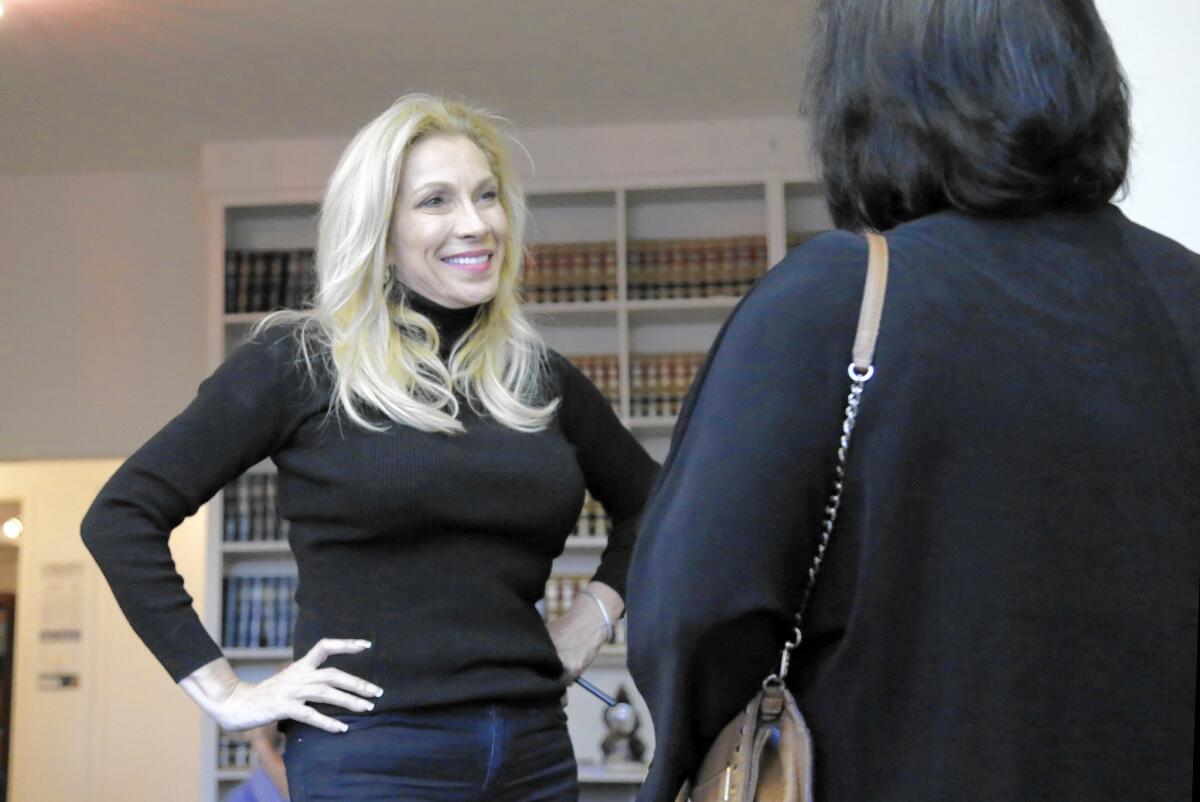 Hostess Cheryl Shuman, a cancer survivor who uses pot regularly and who calls herself "the Martha Stewart of marijuana," greets guests at a "cannabis networking event" in West Hollywood.