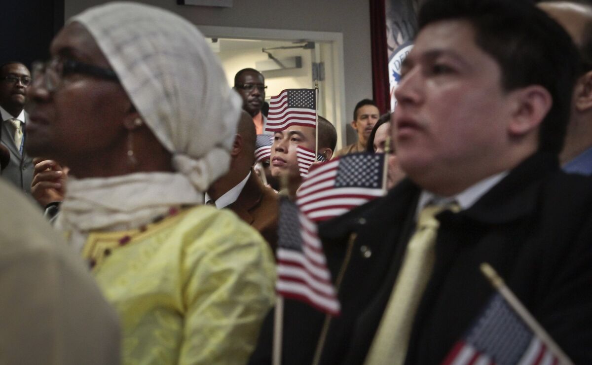 Over the next 50 years, Asians will surge past Latinos to become the largest group of immigrants heading to the U.S., according to a new study. Above, a naturalization ceremony in New York City in 2013.