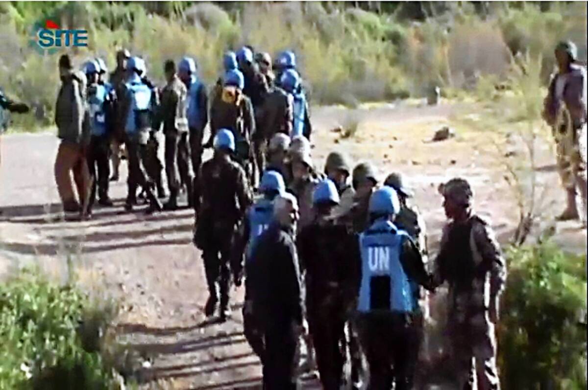 An image from video shows Philippine U.N. peacekeepers crossing into Jordan after being released by Syrian rebels.