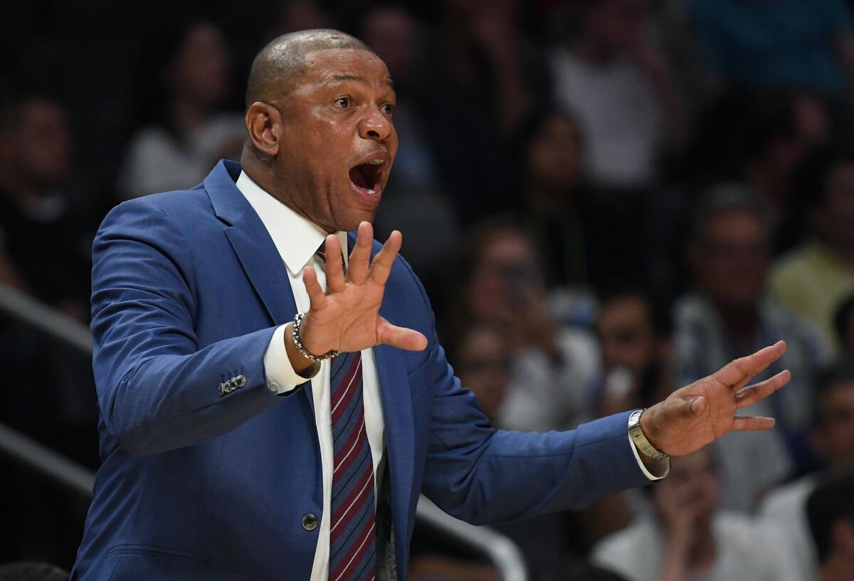 Clippers coach Doc Rivers instructs his players.
