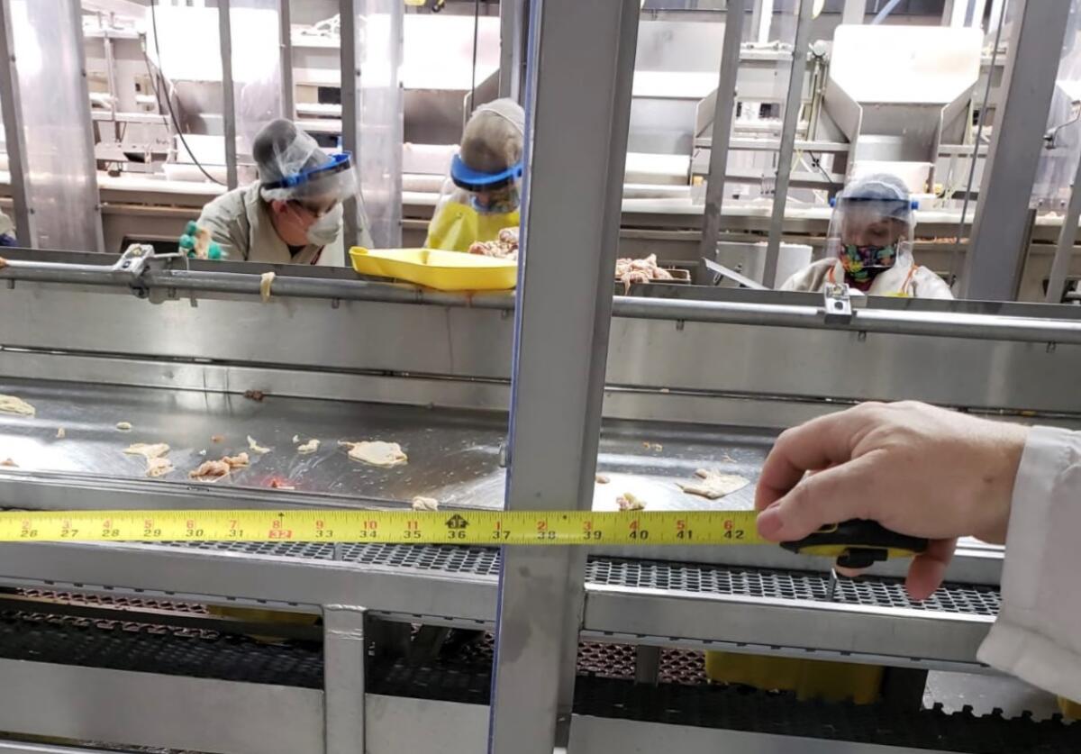 Workers at a Foster Farms meatpacking plant in Livingston, Calif.