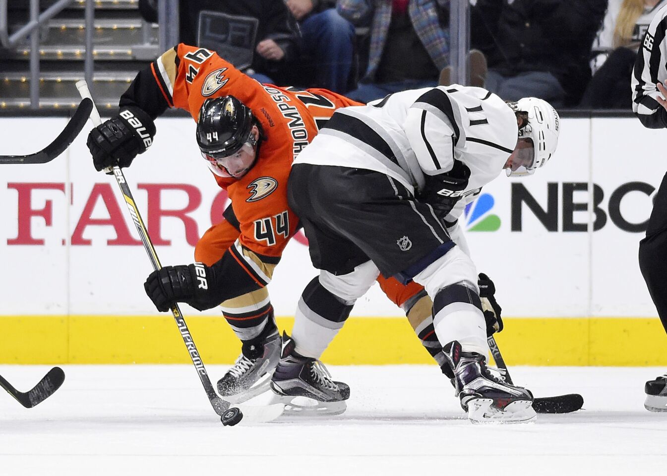 Ducks center Nate Thompson, left, and Kings center Anze Kopitar battle for the puck during the third period.
