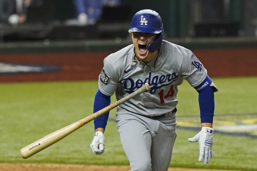 Los Angeles Dodgers' Enrique Hernandez celebrates a RBI-double against the Tampa Bay Rays during the sixth inning in Game 4 of the baseball World Series Saturday, Oct. 24, 2020, in Arlington, Texas. (AP Photo/Eric Gay)