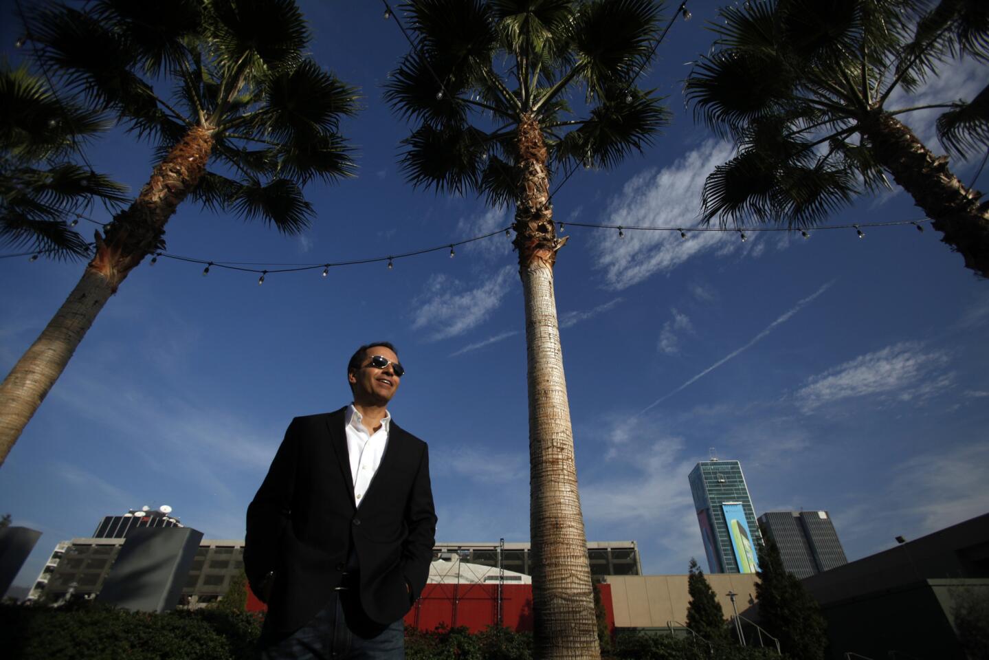 David Simon of Kilroy Realty stands at the site in Hollywood where the firm proposes to build office buildings, apartments, shops and restaurants.