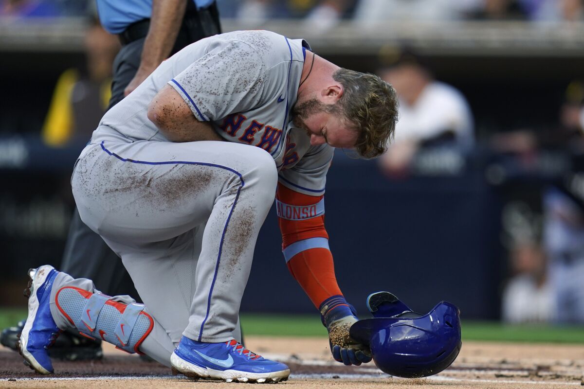 New York Mets' Pete Alonso reacts after being hit by a pitch while batting during the second inning of the team's baseball game against the San Diego Padres on Tuesday, June 7, 2022, in San Diego. (AP Photo/Gregory Bull)