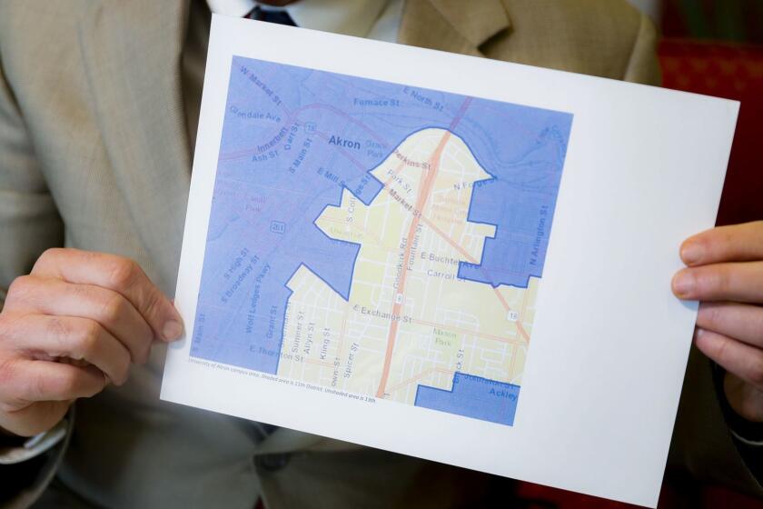 David Niven, a professor of political science at the University of Cincinnati holds a map demonstrating a gerrymandered Ohio district, Thursday, April 11, 2019, in Cincinnati. Congressional Democrats nationwide had a good year in 2018, gaining 40 seats. But Republicans held fast with 75% of Ohios House seats, despite winning only 52% of Ohios congressional vote total. Not a single seat has changed hands, said Niven, who testified for those challenging Ohios map. Not a single seat. The point of this map was to build a seawall against the storm, and it has held. (AP Photo/John Minchillo)