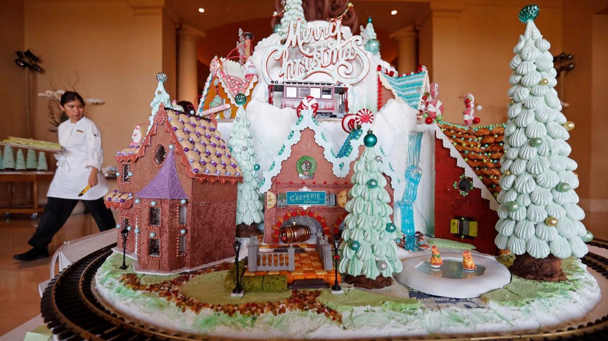 The Resort at Pelican Hill in Newport Coast began assembling its annual gingerbread village on Monday. The 9-foot-tall, 300-pound creation will serve as the backdrop for the resort’s “Kris Kringle Story Time Mingle” running weekends from Saturday through Dec. 24.