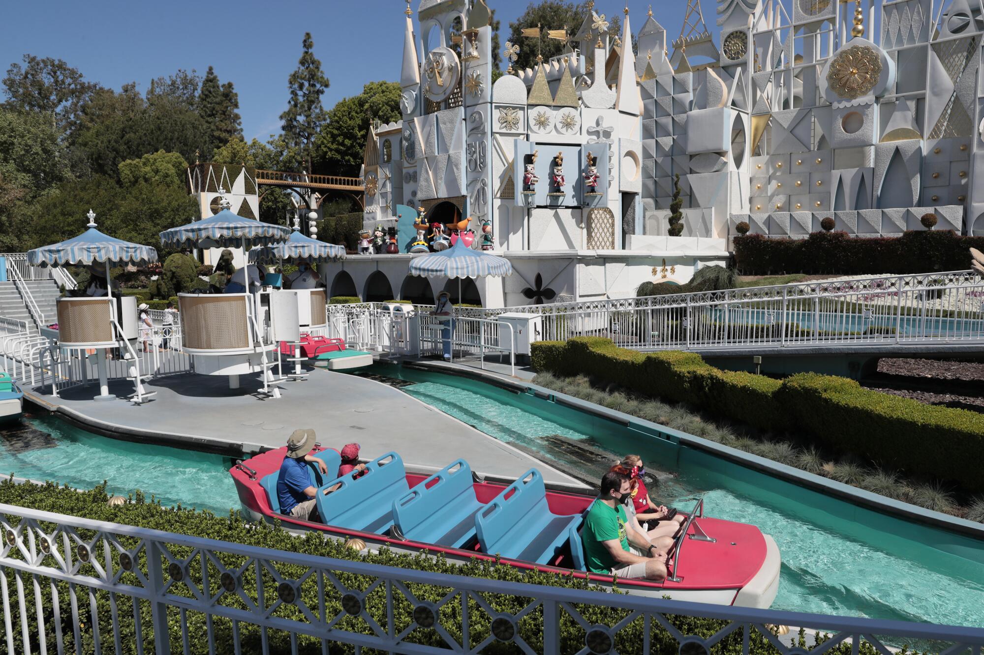 A boat on the Small World ride carries only one couple in the front row and one couple in the fifth row.