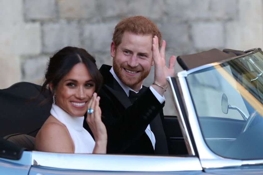 Britain's Prince Harry, Duke of Sussex, and Meghan Markle, Duchess of Sussex, leave Windsor Castle