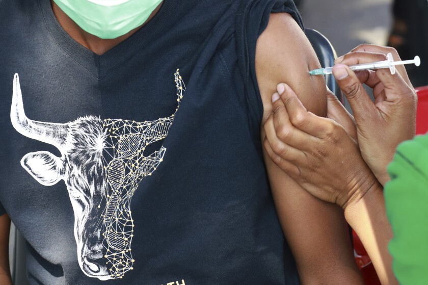 A man receiving an injection in his arm