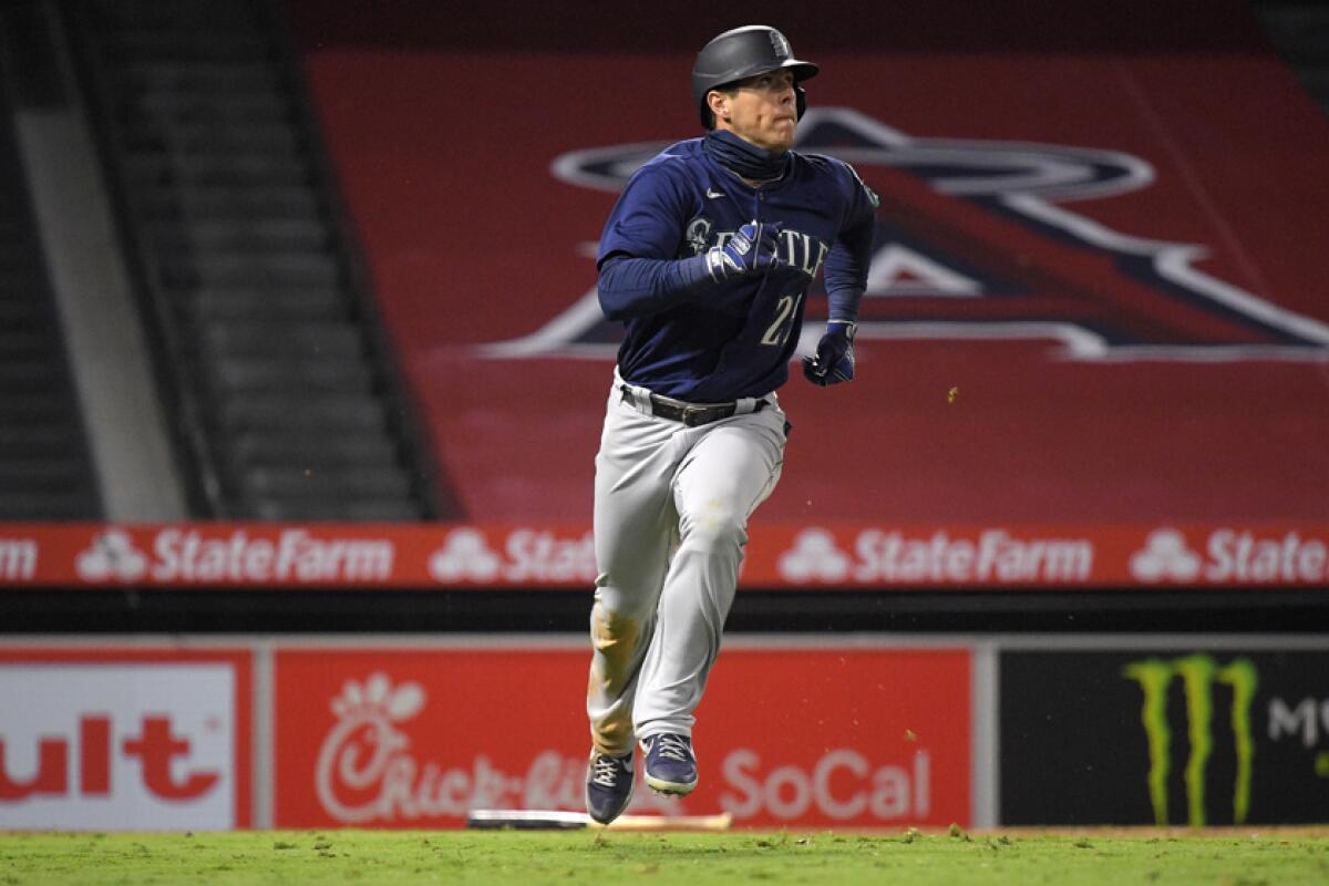 The Mariners' Dylan Moore rounds the bases after hitting a three-run homer in the sixth inning Wednesday night.