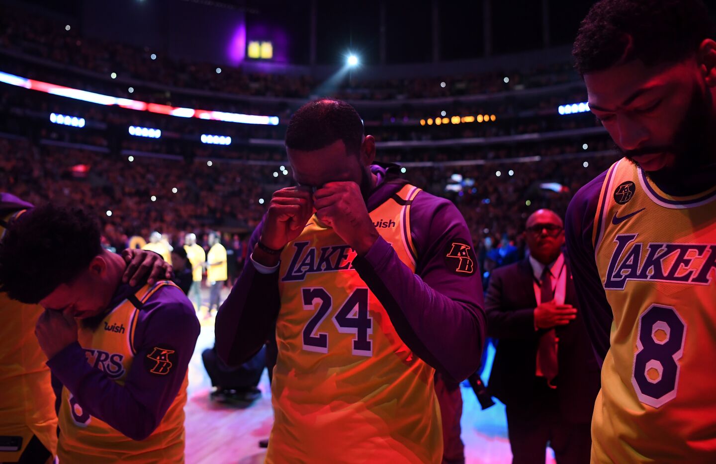 Lakers teammates (from left) Quin Cook, LeBron James and Anthony Davis stand during a pregame ceremony honoring the life of Kobe Bryant at Staples Center on Jan. 31, 2020.