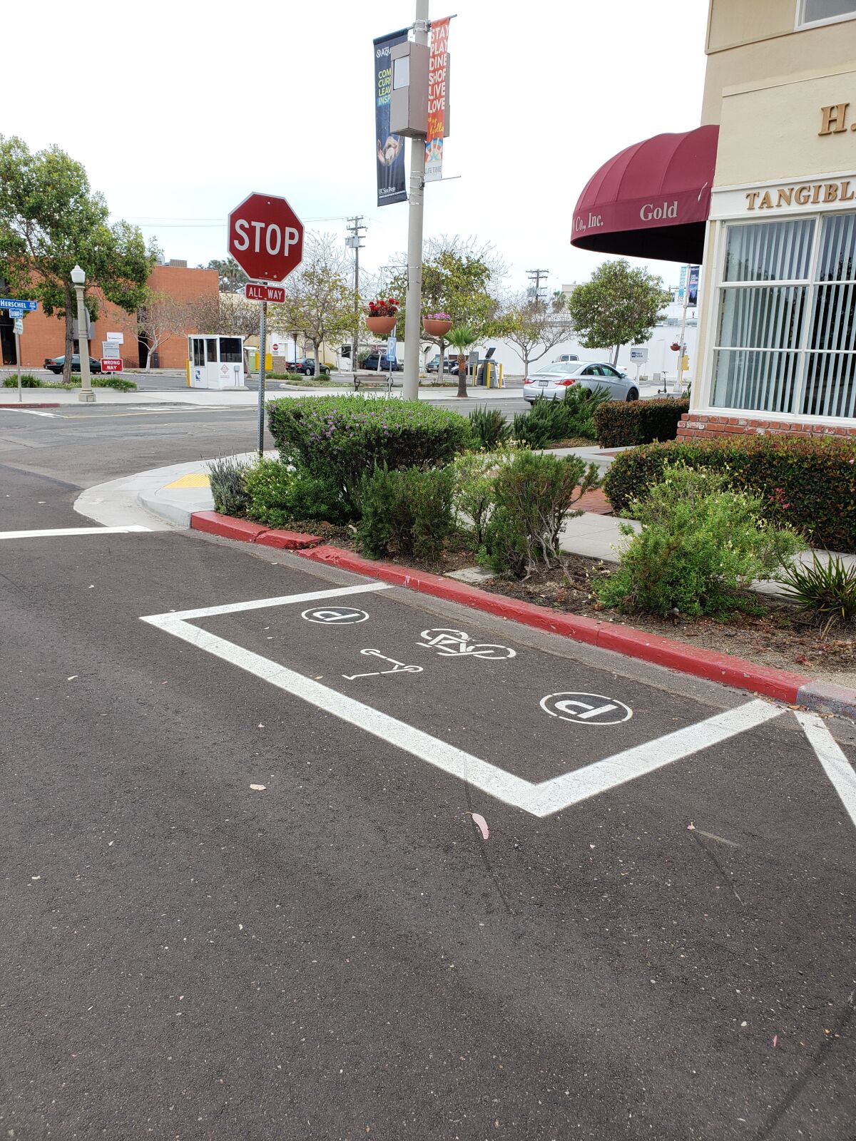 An area designed to place dockless scooters and other small rental vehicles sits empty in The Village.