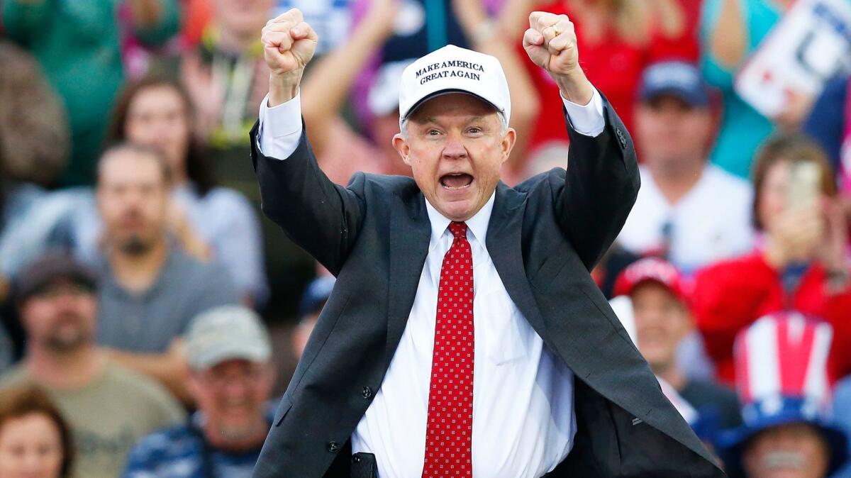 Attorney General-designate, Sen. Jeff Sessions, R-Ala, cheers on the crowd during a rally for President-elect Donald Trump at the Ladd–Peebles Stadium in Mobile, Ala. on Dec. 17.