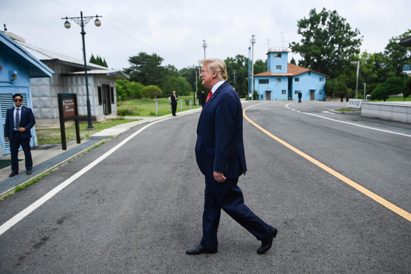President Trump walks toward the Military Demarcation Line that divides North and South Korea.