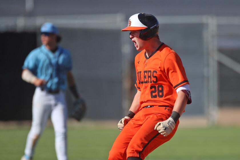 Trent Grendlinger (28) of Huntington Beach reaches second base on a double.