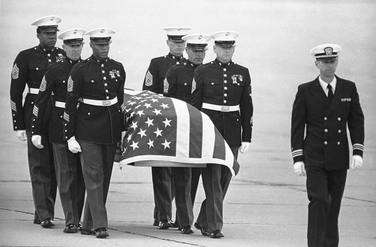 U.S. Marine Corps pallbearers carry the casket holding the body of slain U.S. Drug Enforcement agent Enrique Camarena Salazar
