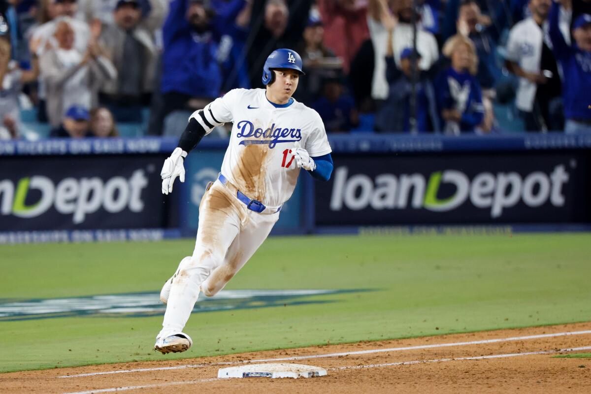 Dodgers star Shohei Ohtani runs the bases during the fourth inning of Game 1 of the NLCS.