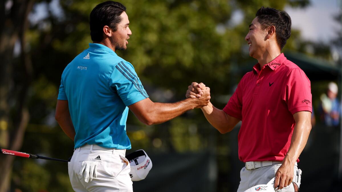 Jason Day, left, and Sang-Moon Bae congratulate each other Saturday after they finished the third round of the Barclays tied for the lead.