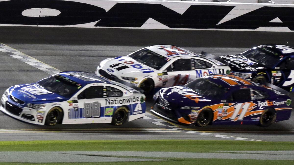 Dale Earnhardt Jr. (88) leads Denny Hamlin (11), Clint Bowyer (14) and Kasey Kahne (5) in the closing laps of the second of two Daytona 500 qualifying races on Thursday.