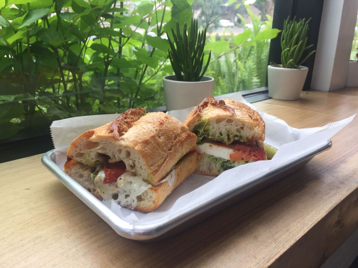 A toasted Mozzarella, roasted tomato and pesto sandwich on sourdough bread at the Live Culture Cafe in Leucadia.