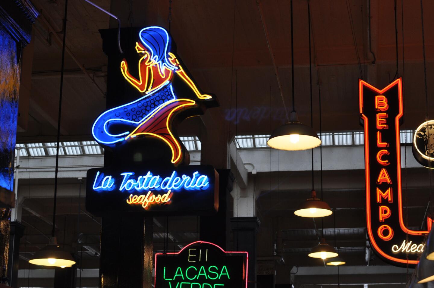 La Tostaderia's neon mermaid is among the signage in downtown Los Angeles' Grand Central Market.