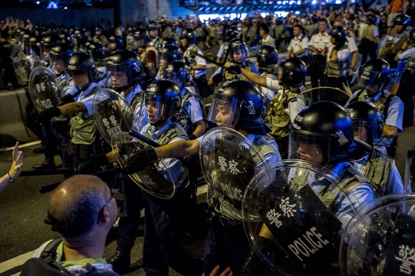 Police confront pro-democracy protesters.