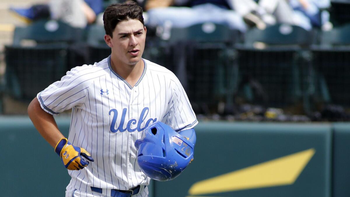UCLA's Michael Toglia looks to the dugout following his home run against Washington at Jackie Robinson Stadium on May 19. Toglia was selected by the Colorado Rockies in the first round of the MLB draft on Monday.