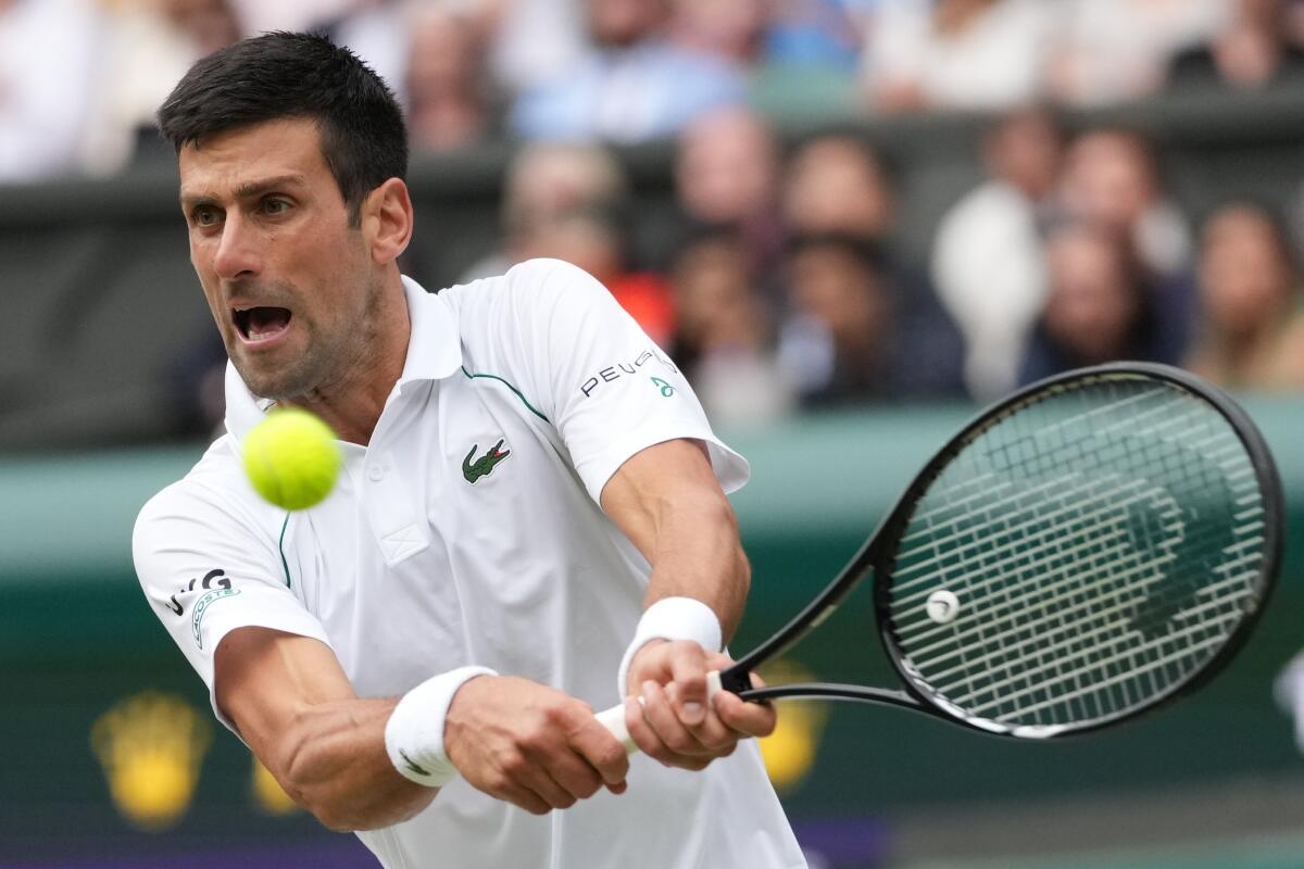Serbia's Novak Djokovic plays at Wimbledon