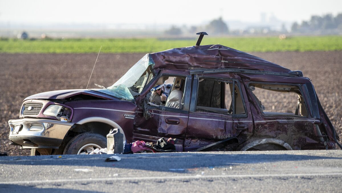 A collision between a big rig and an SUV carrying 25 people near the U.S.-Mexico border Tuesday morning killed at least 13.