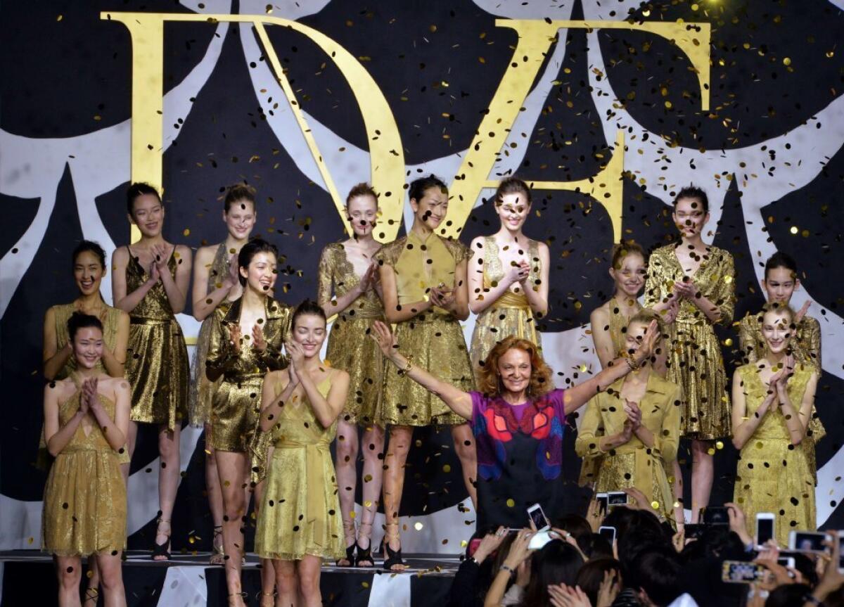 Diane von Furstenberg with models at the runway finale of Tokyo Fashion Week. According to Vanity Fair, the designer has inked a deal with E! for a reality TV series.