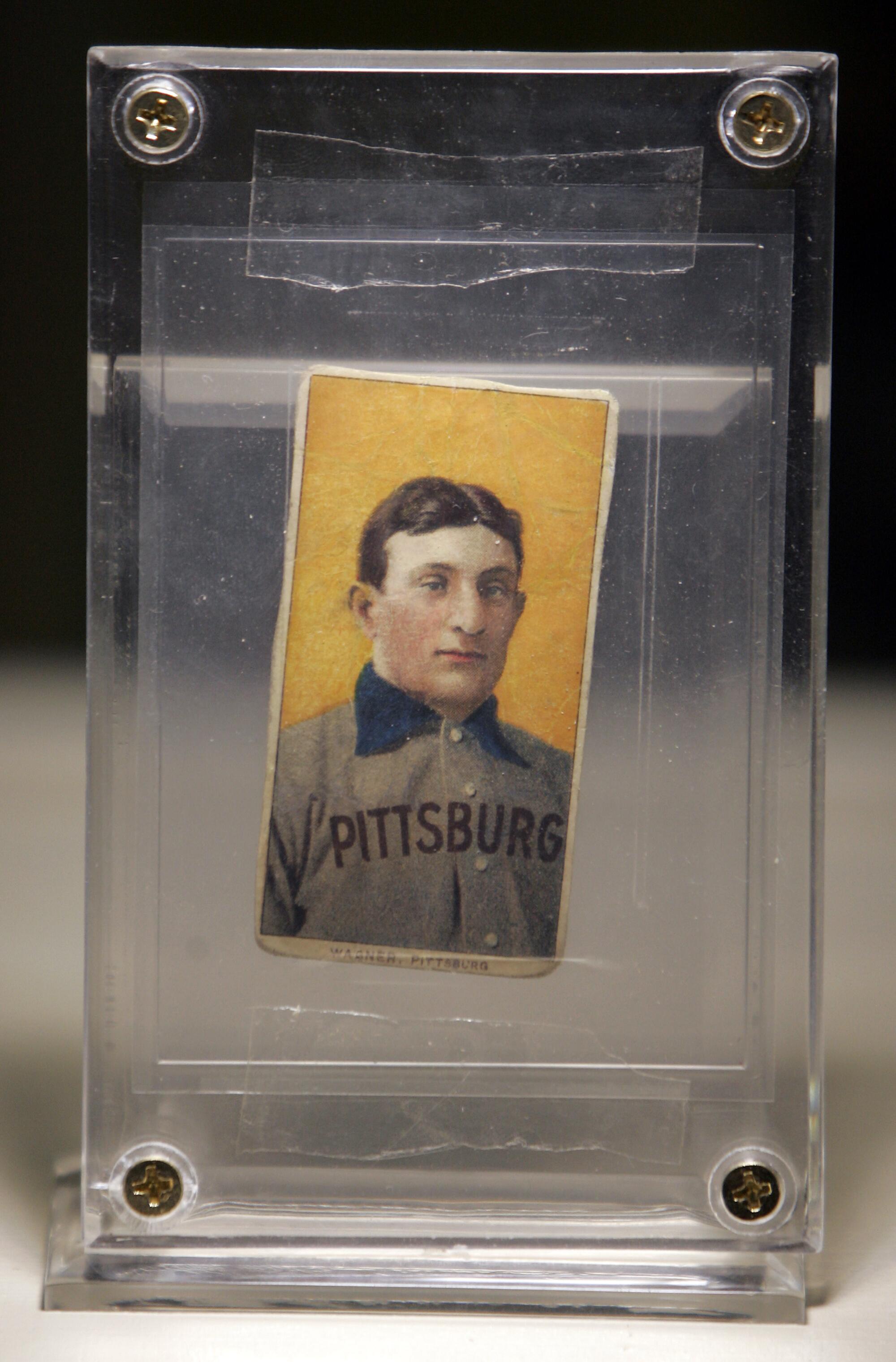 A framed Honus Wagner baseball card