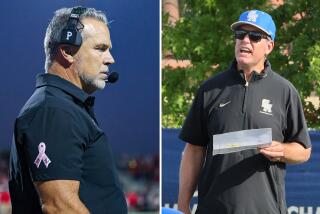 Corona Centennial coach Matt Logan, left, and Santa Margarita coach Carson Palmer.